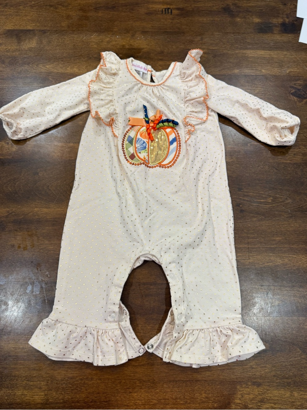 Bonnie Baby Cream Romper with Pumpkin Applique and Ruffle Trim
